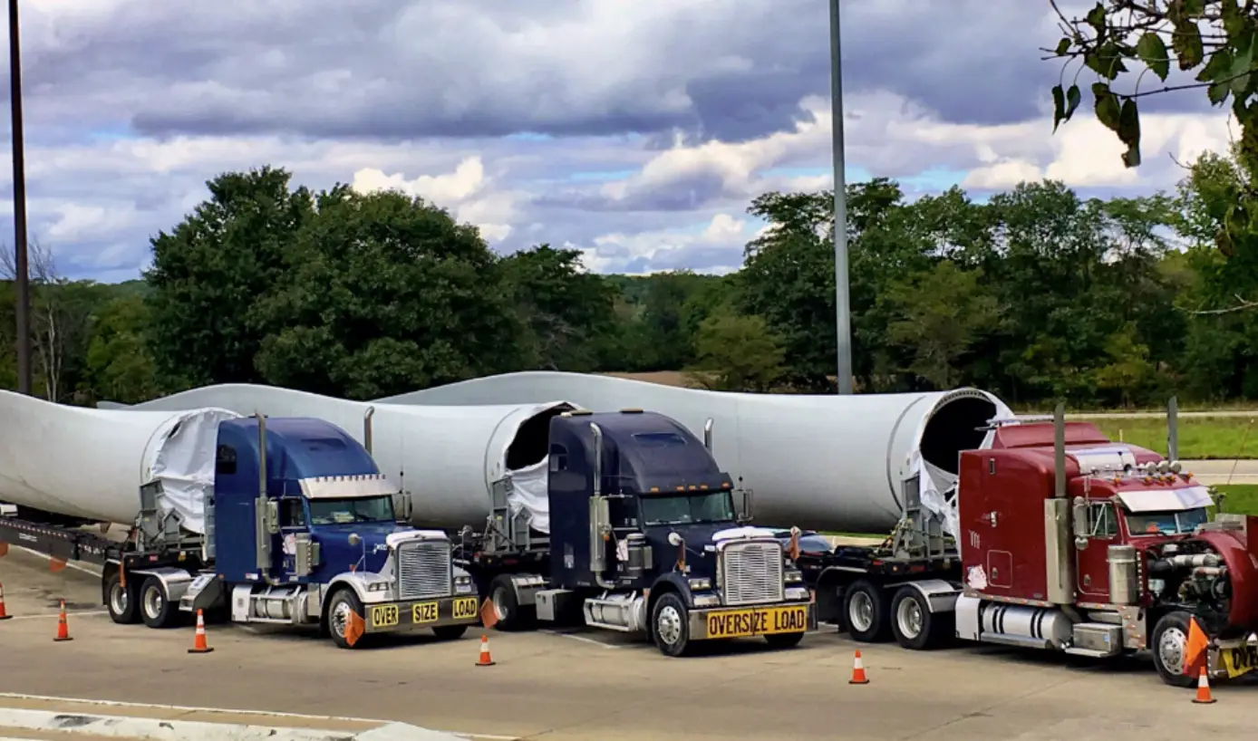 Semi-trucks hauling oversized wind turbine components for LeCoop Truck and Trailer heavy haul services
