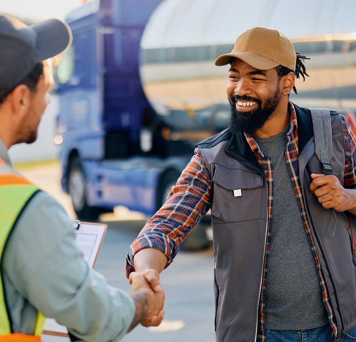 Commercial truck driver greeting staff member at LeCoop Truck and Trailer